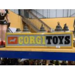 AN ILLUMINATED CORGI TOYS SIGN