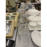 FIVE CUT GLASS DECANTERS