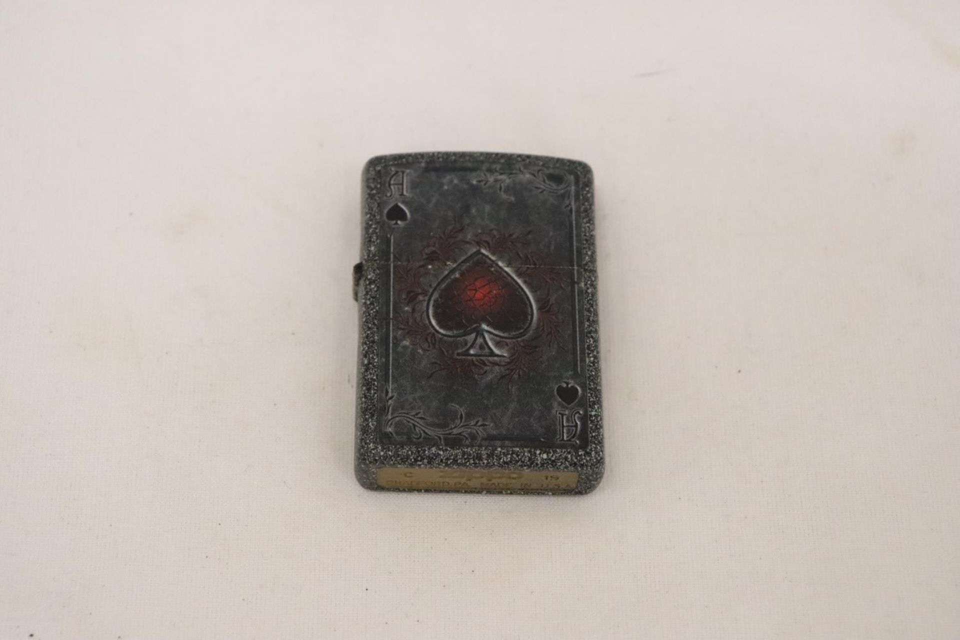 A ZIPPO, BRADFORD, ACE OF SPADES LIGHTER