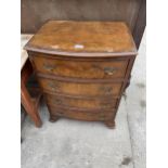 A REPRODUCTION WALNUT BOW-FRONTED CHEST OF 4 DRAWERS - 23 INCH WIDE