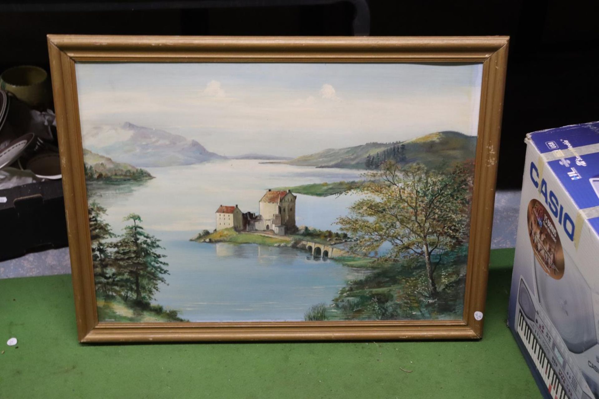 AN OIL ON BOARD OF A HOUSE, LAKE AND MOUNTAIN SCENE, SIGNED FEARN, 80CM X 60CM