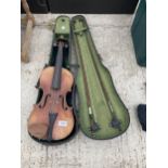 A VINTAGE VIOLIN WITH TWO BOWS AND A CARRY CASE