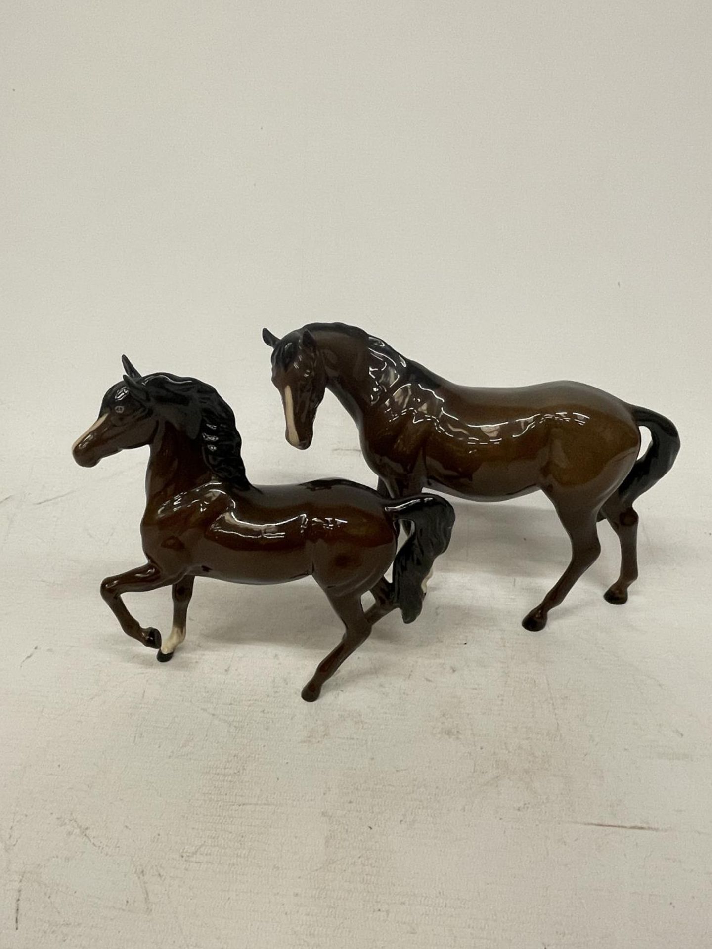 TWO BESWICK BAY HORSES TO INCLUDE A PRANCING EXAMPLE