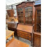 A MID 20TH CENTURY WALNUT BUREAU BOOKCASE ON CABRIOLE LEGS WITH BALL AND CLAW FEET 36" WIDE