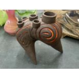 A STUDIO POTTERY STONEWARE ABSTRACT FLOWER HOLDER