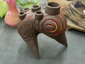 A STUDIO POTTERY STONEWARE ABSTRACT FLOWER HOLDER