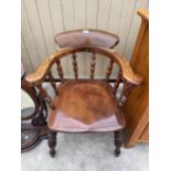 A VICTORIAN ELM AND BEECH CAPTAINS CHAIR STAMPED W.C