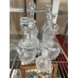 SIX VARIOUS CUT GLASS DECANTERS AND A FURTHER GLASS DECANTER WITH STOPPERS