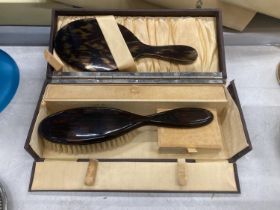 A BOXED BRUSH AND MIRROR SET