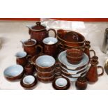 A QUANTITY OF DENBY DINNER AND TEAWARE TO INCLUDE A COFFEE POT, HOT WATER JUG, CREAM JUG, SUGAR