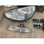 A FORD HEADLIGHT AND SIDE LIGHT