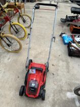 AN EINHELL BATTERY POWERED LAWNMOWER (LACKING BATTERY AND GRASS BOX)