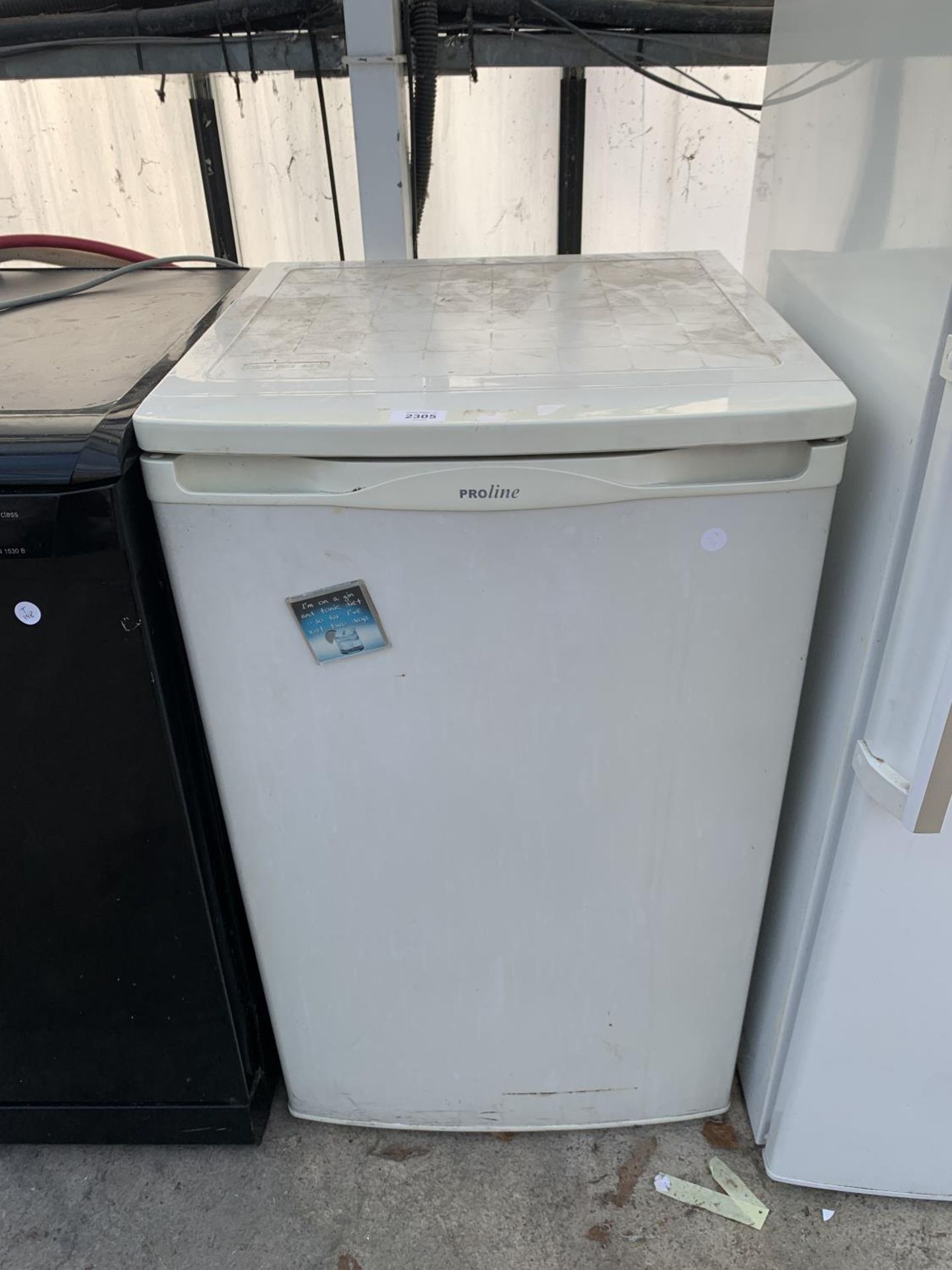 A WHITE PROLINE UNDERCOUNTER FRIDGE