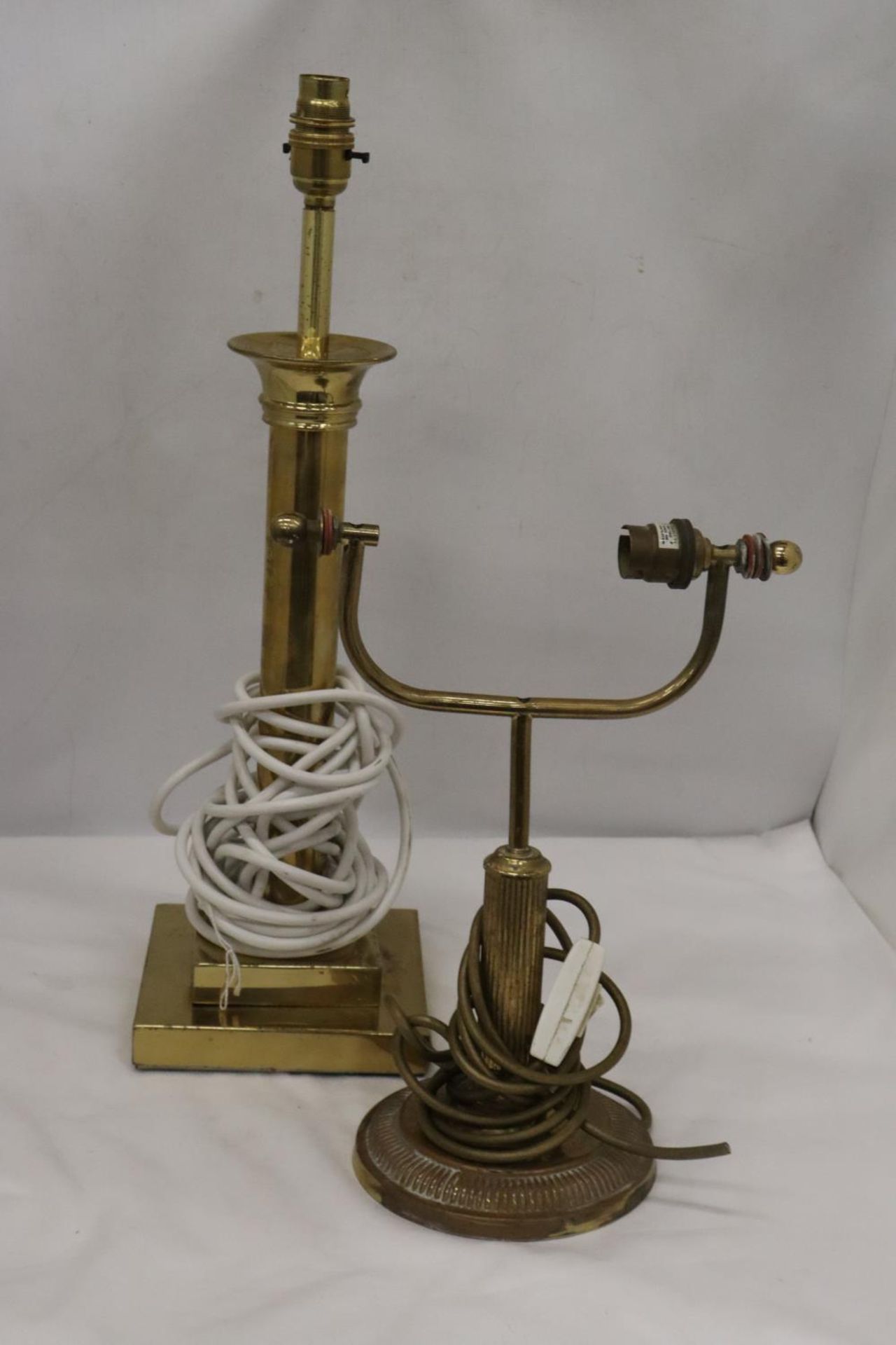 A BRASS BANKER'S LAMP AND BRASS PEDESTAL LAMP