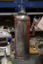 A VINTAGE FIRE EXTINGUISHER WITH BRASS PLUNGER