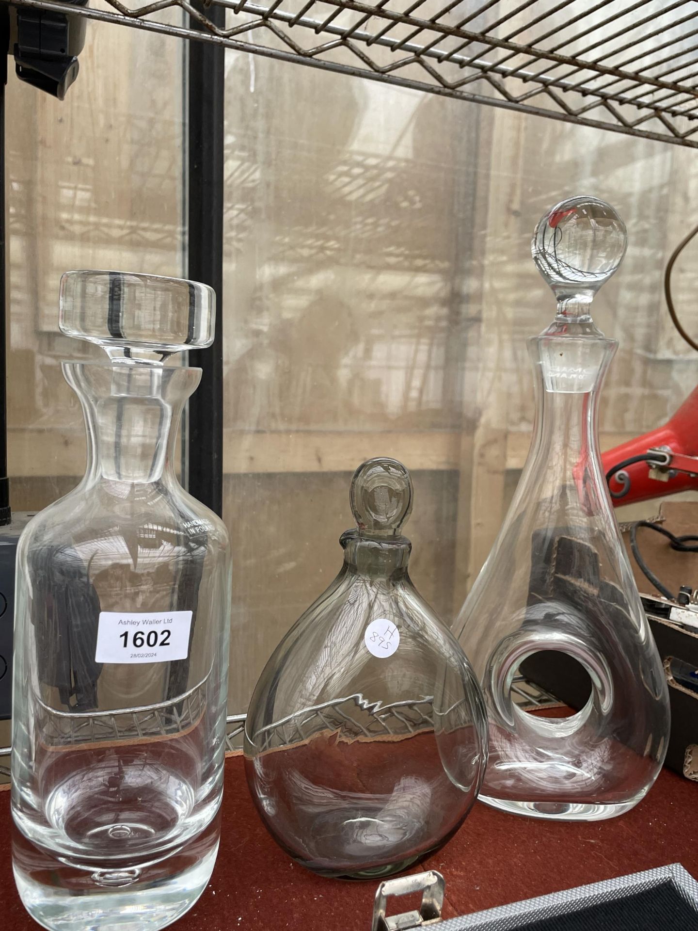 THREE VARIOUS GLASS DECANTERS