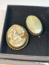 TWO BROOCHES TO INCLUDE A LUSTRE SHELL AND A CAMEO