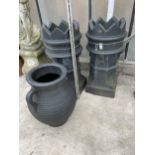 TWO BLACK PLASTIC CHIMNEY POTS AND A BLACK PLASTIC URN