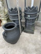 TWO BLACK PLASTIC CHIMNEY POTS AND A BLACK PLASTIC URN