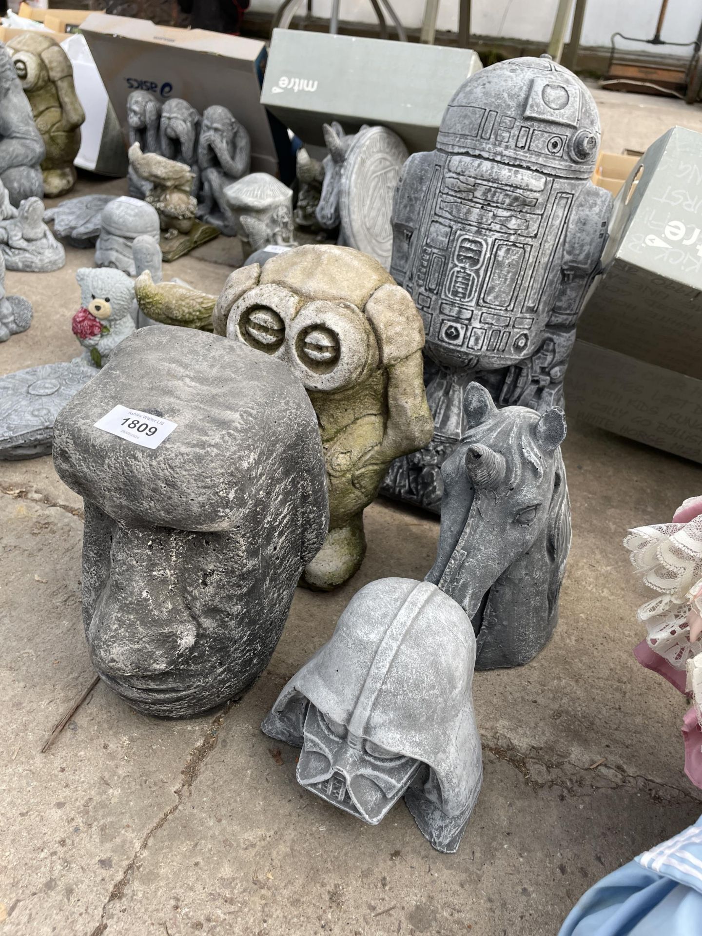 FIVE VARIOUS CONCRETE GARDEN FIGURES TO INCLUDE DARTH VADER AND A HORSE HEAD ETC