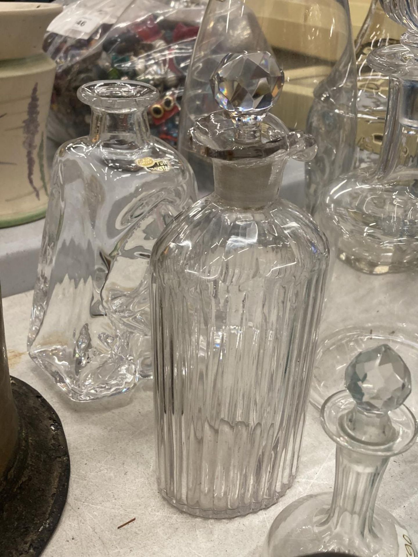 A QUANTITY OF GLASS BOTTLES SOME WITH STOPPERS AND DECANTERS - Image 4 of 4