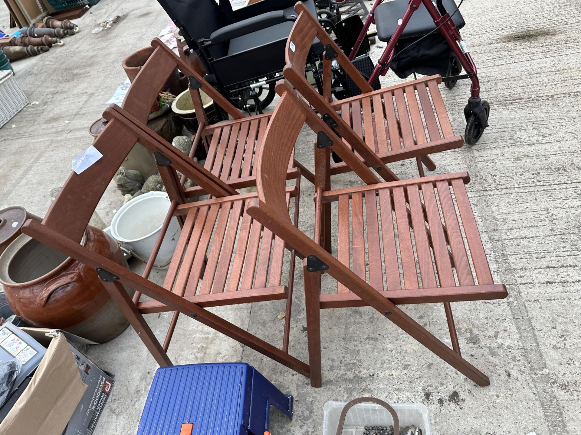 A SET OF FOUR TEAK FOLDING GARDEN CHAIRS - Image 2 of 2