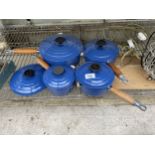 A SET OF FOUR GRADUATED BLUE LE CRUESET PANS WITH LIDS AND A FURTHER SPARE LID