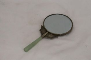 A JADE AND WHITE METAL BIRD MIRROR