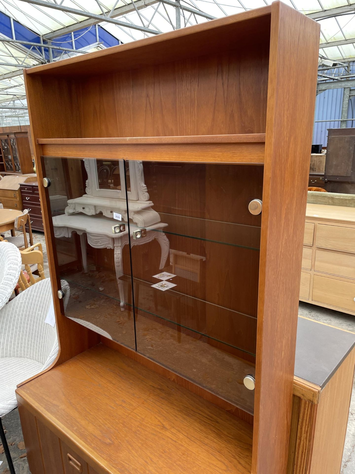 A RETRO TEAK LOUNGE UNIT WITH SMOKED GLASS DOORS, CUPBOARD AND DRAWERS TO BASE. 39.5" WIDE - Image 2 of 3