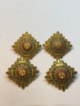 FOUR MILITARY METAL PIP BADGES