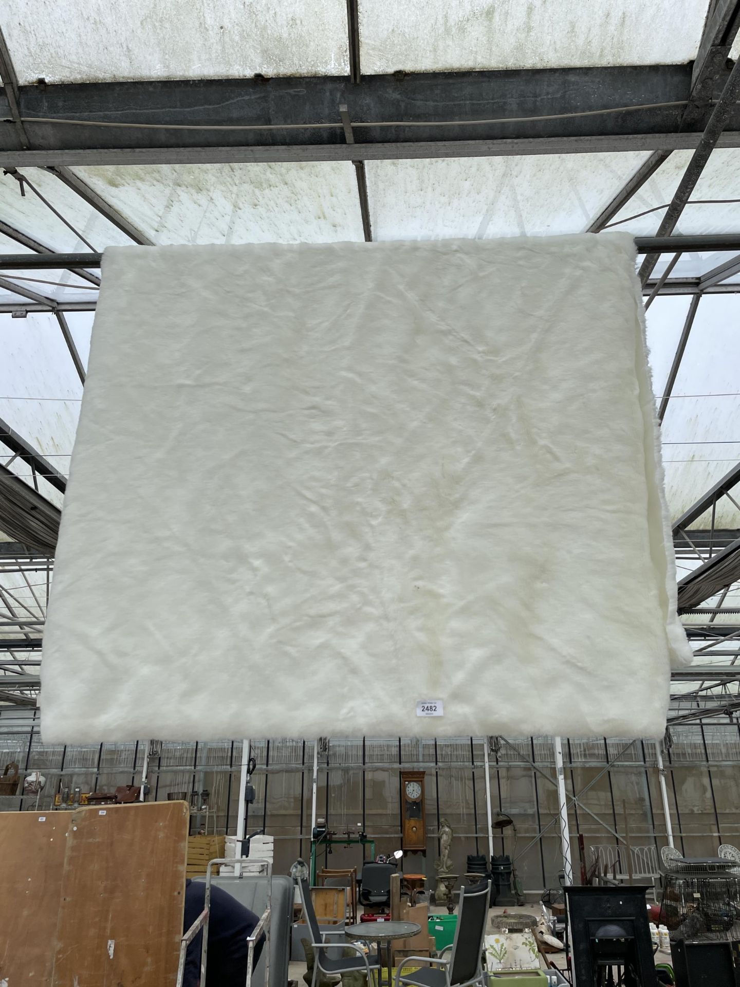 A MODERN SHAGGY WHITE THROW