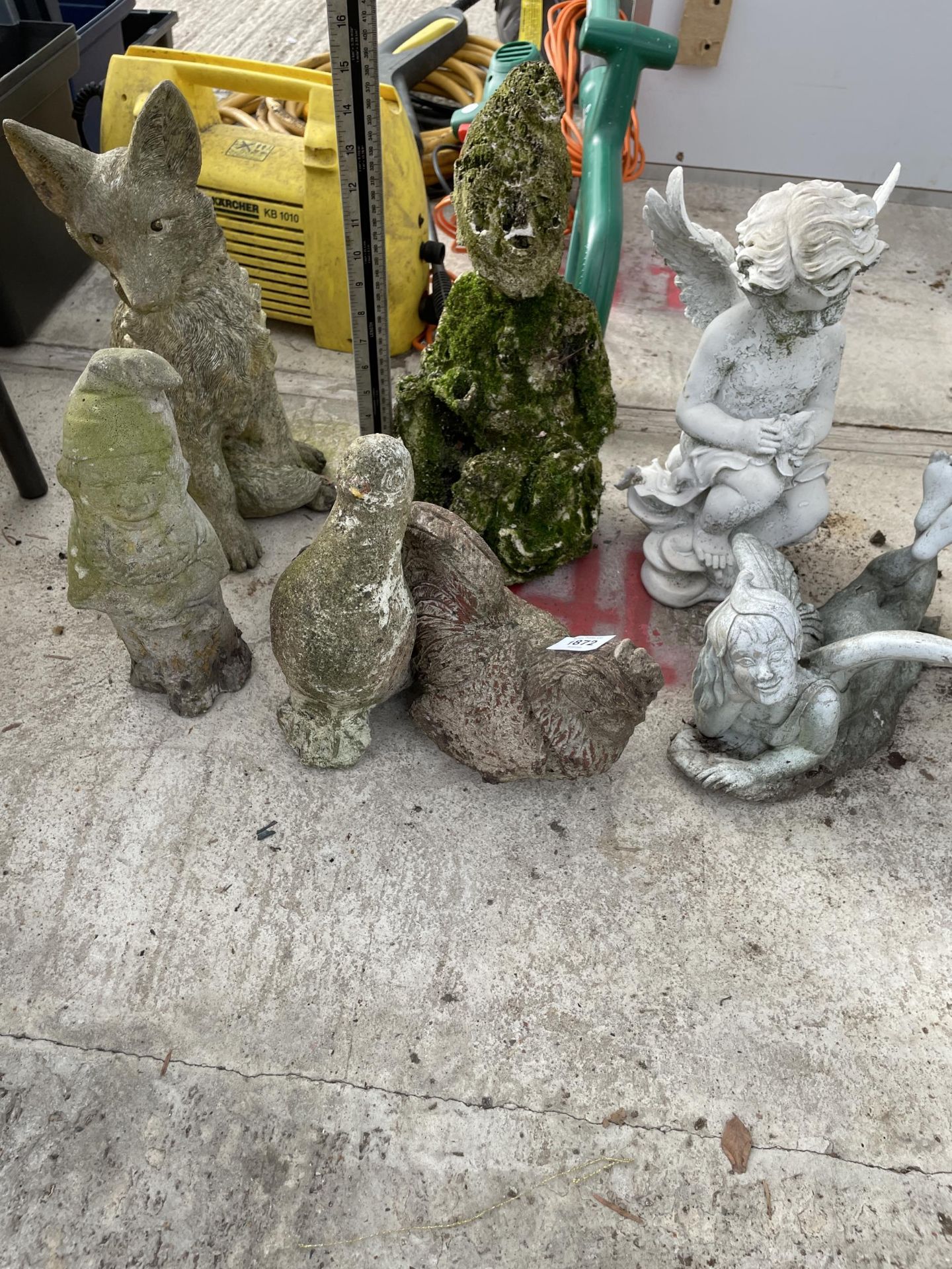 AN ASSORTMENT OF CONCRETE GARDEN FIGURES TO INCLUDE PIXIES AND A FOX ETC