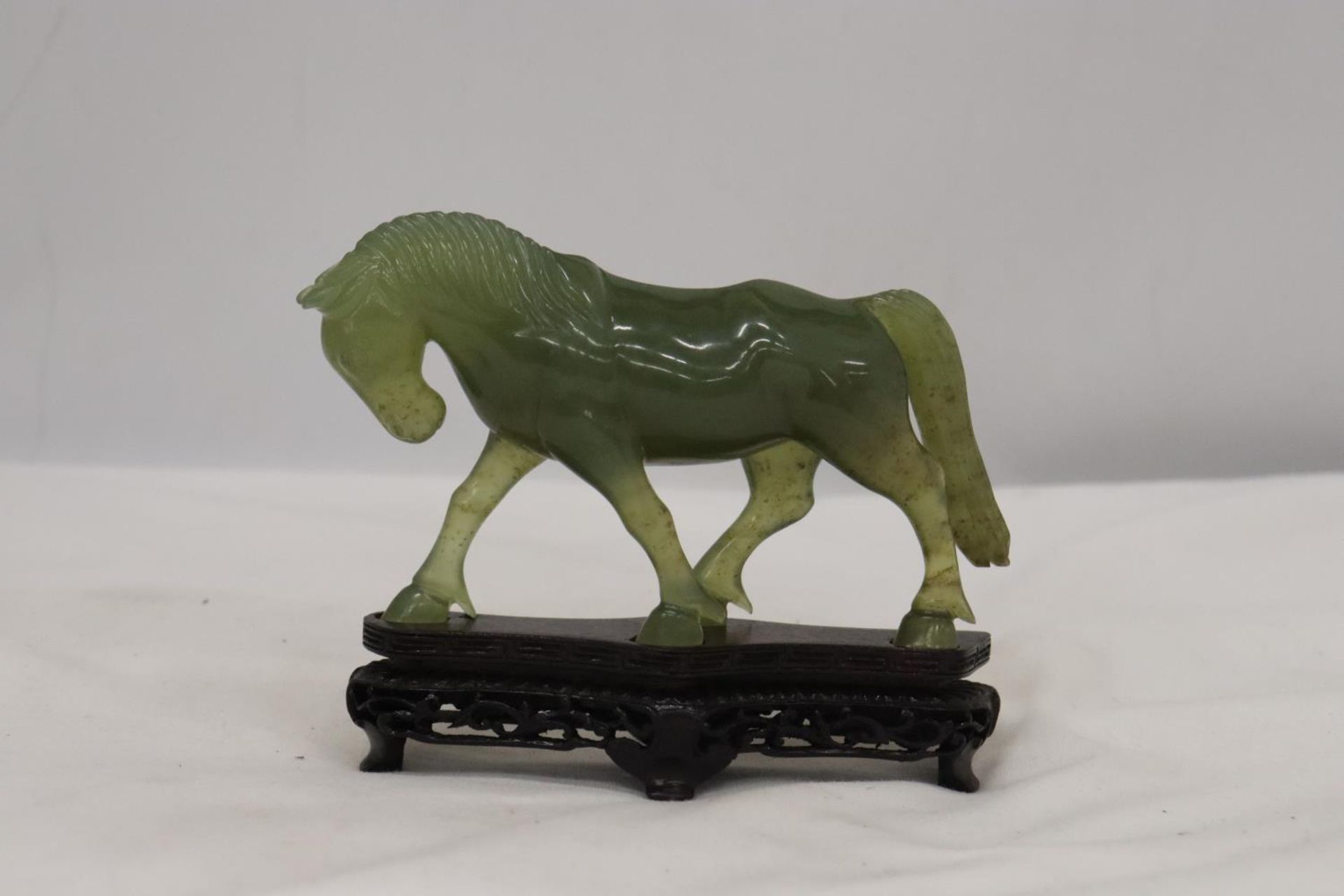 A JADE HORSE ON STAND