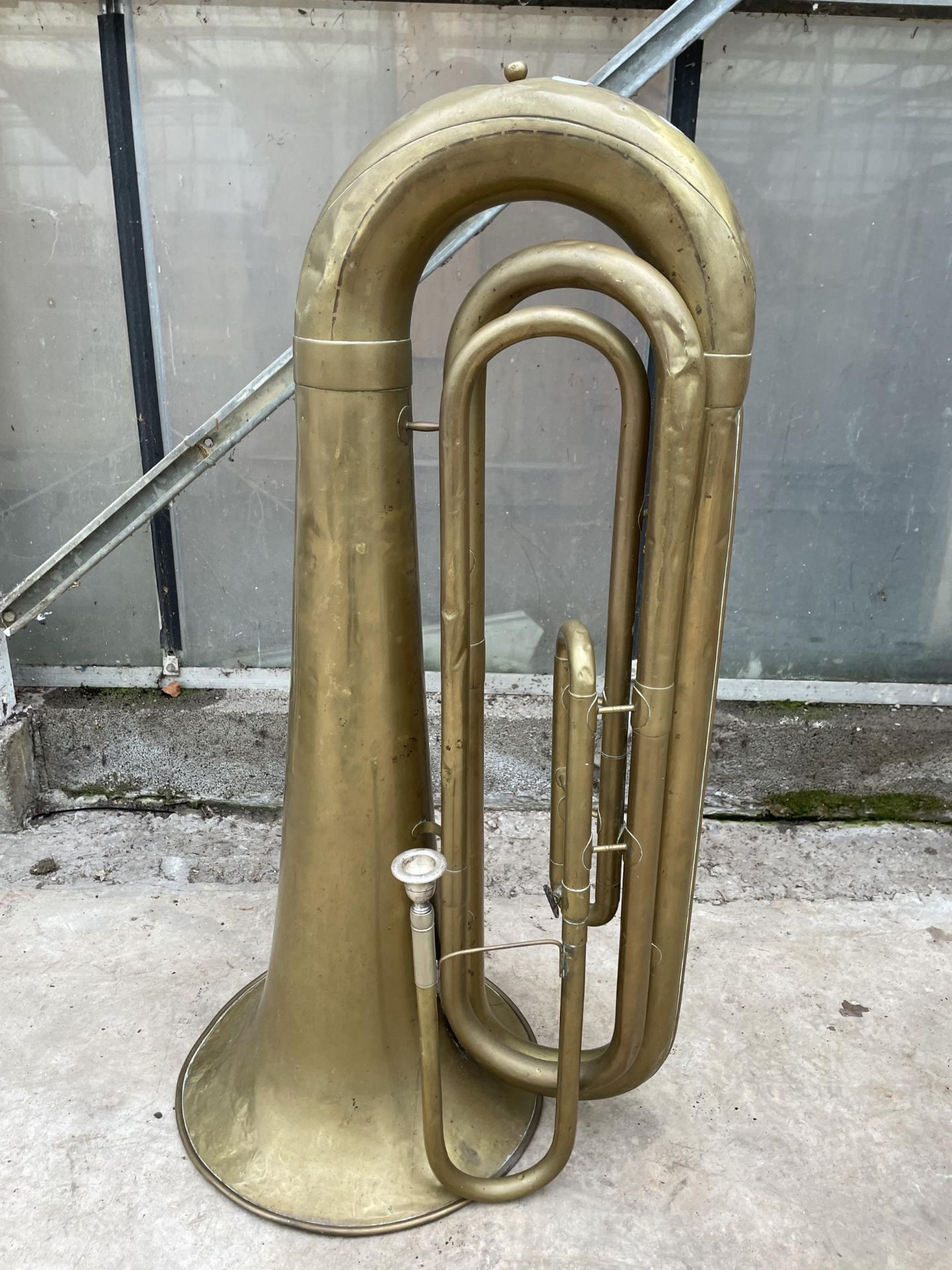 A VINTAGE BRASS TUBA