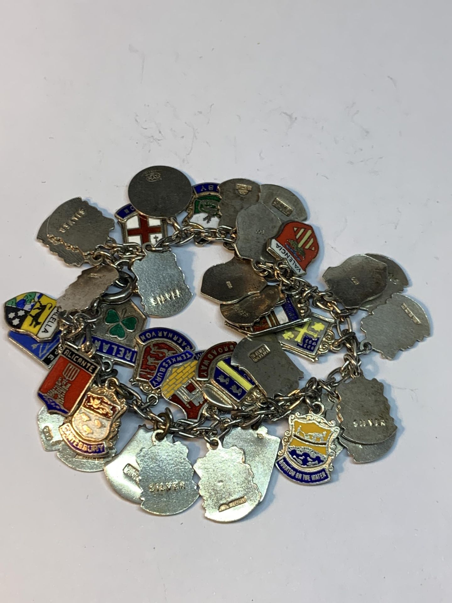 A SILVER CHARM BRACELET WITH FORTY ENAMEL PLACE NAME CHARMS - Image 6 of 6