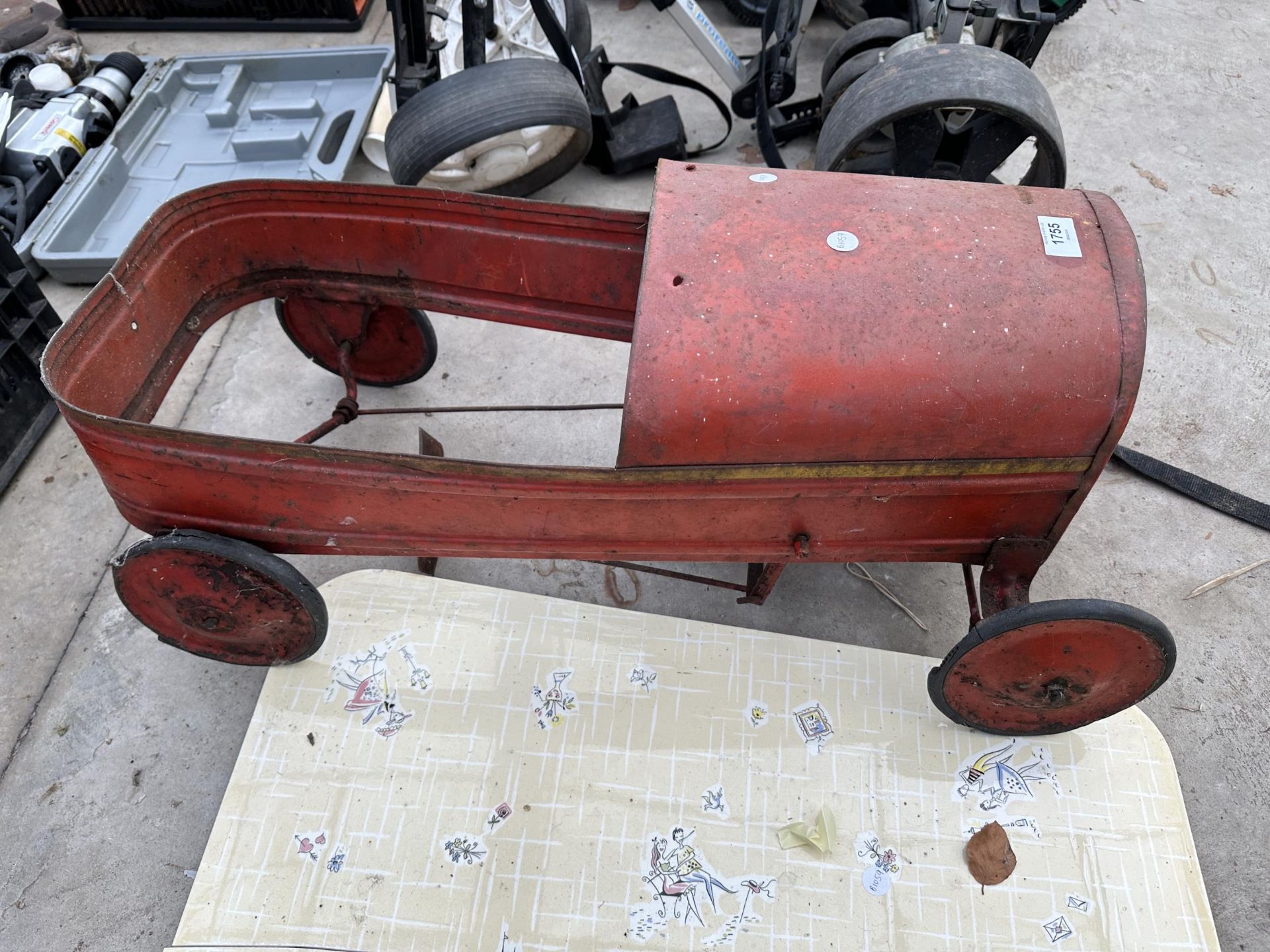 A VINTAGE TIN CHILDS CAR AND A LARGE CERAMIC TILE (TILE A/F)