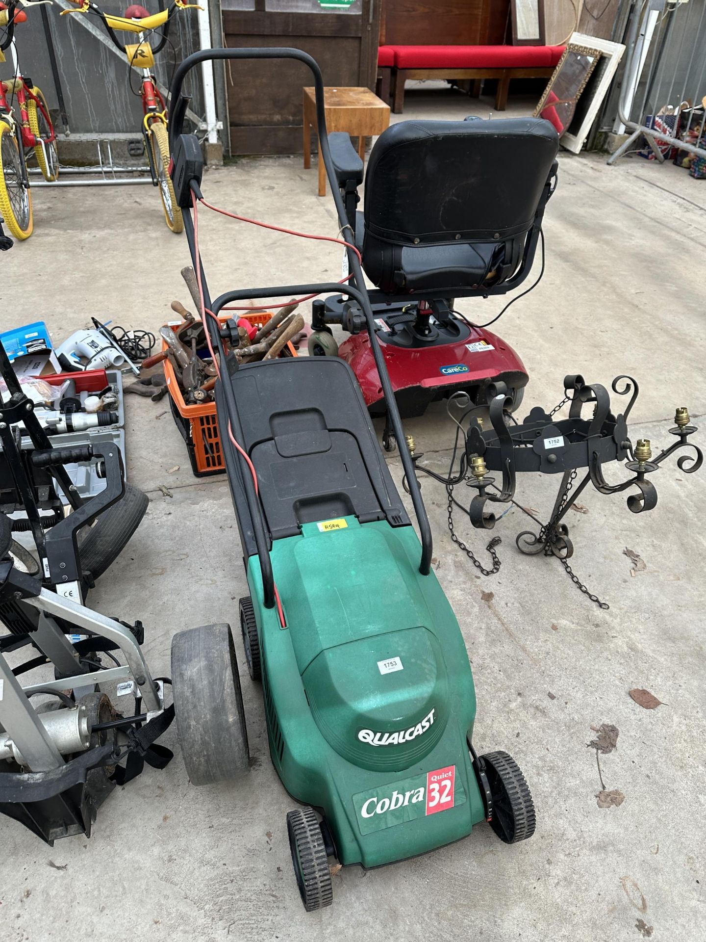 AN ELECTRIC QUALCAST COBRA LAWN MOWER WITH GRASS BOX