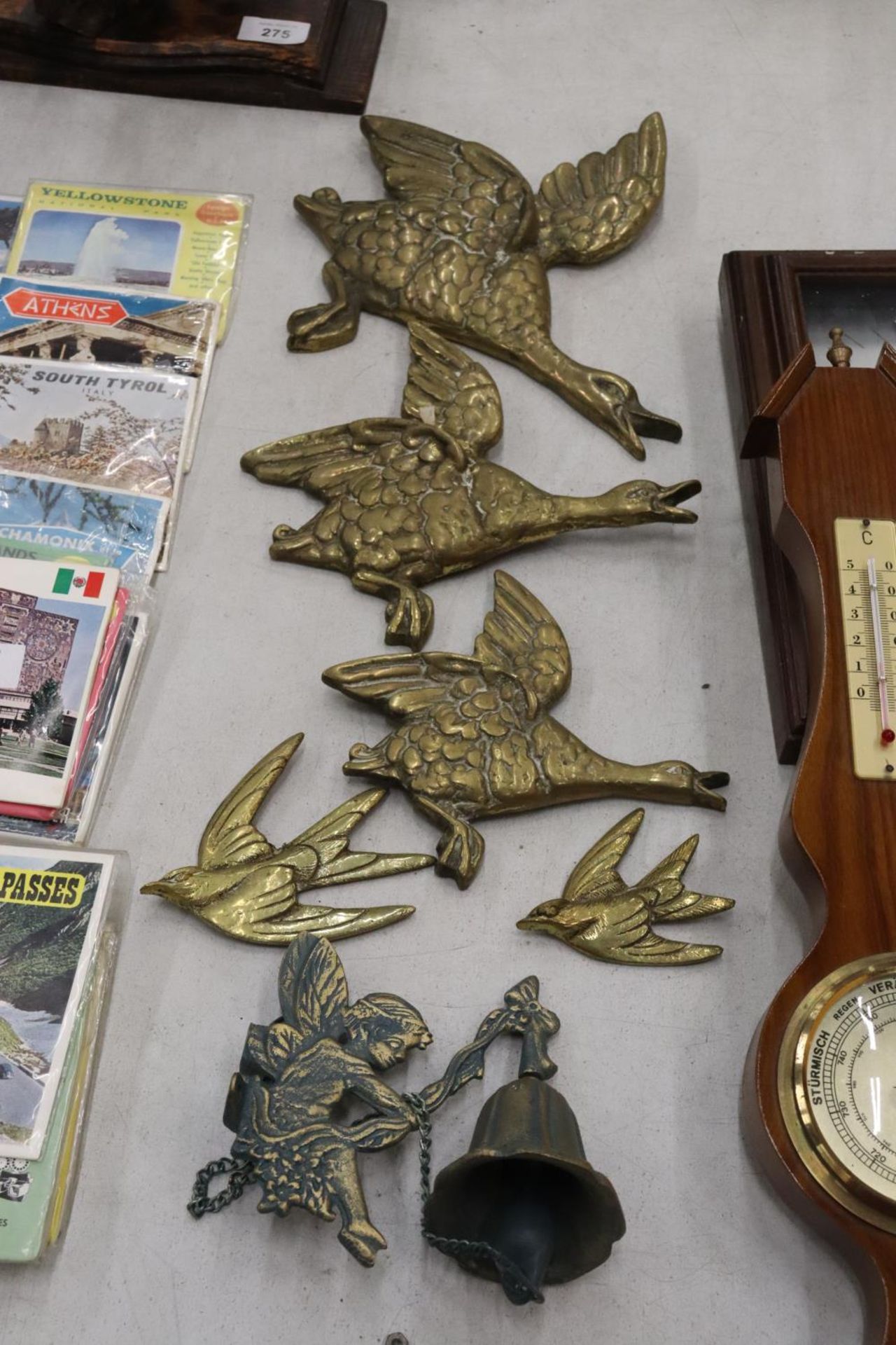 THREE BRASS FLYING DUCKS, TWO SWALLOWS AND A FAIRY BELL