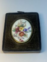 A ROYAL WORCESTER OVAL BROOCH