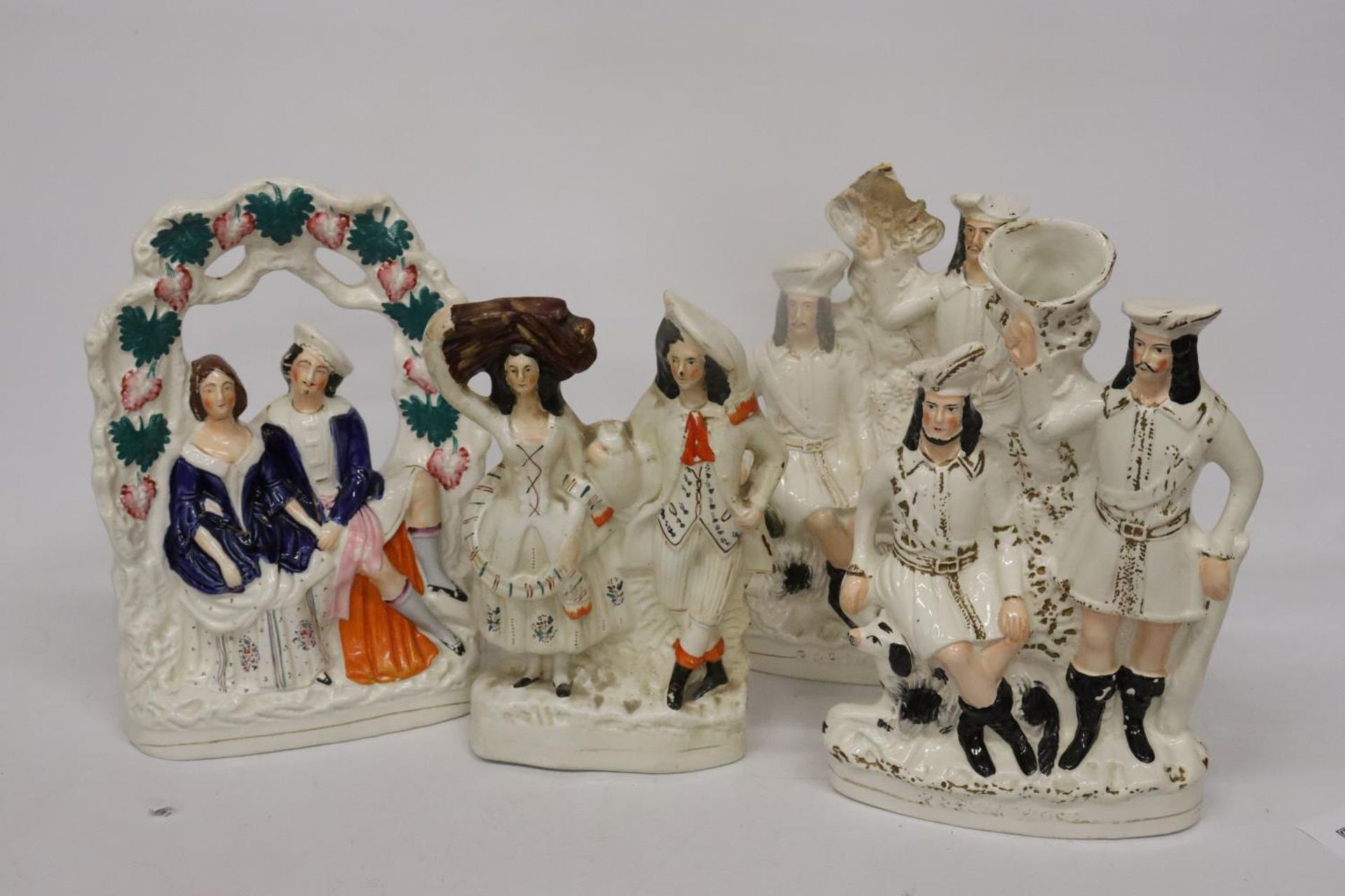 FOUR LARGE STAFFORDSHIRE FLAT BACK FIGURES (A/F)