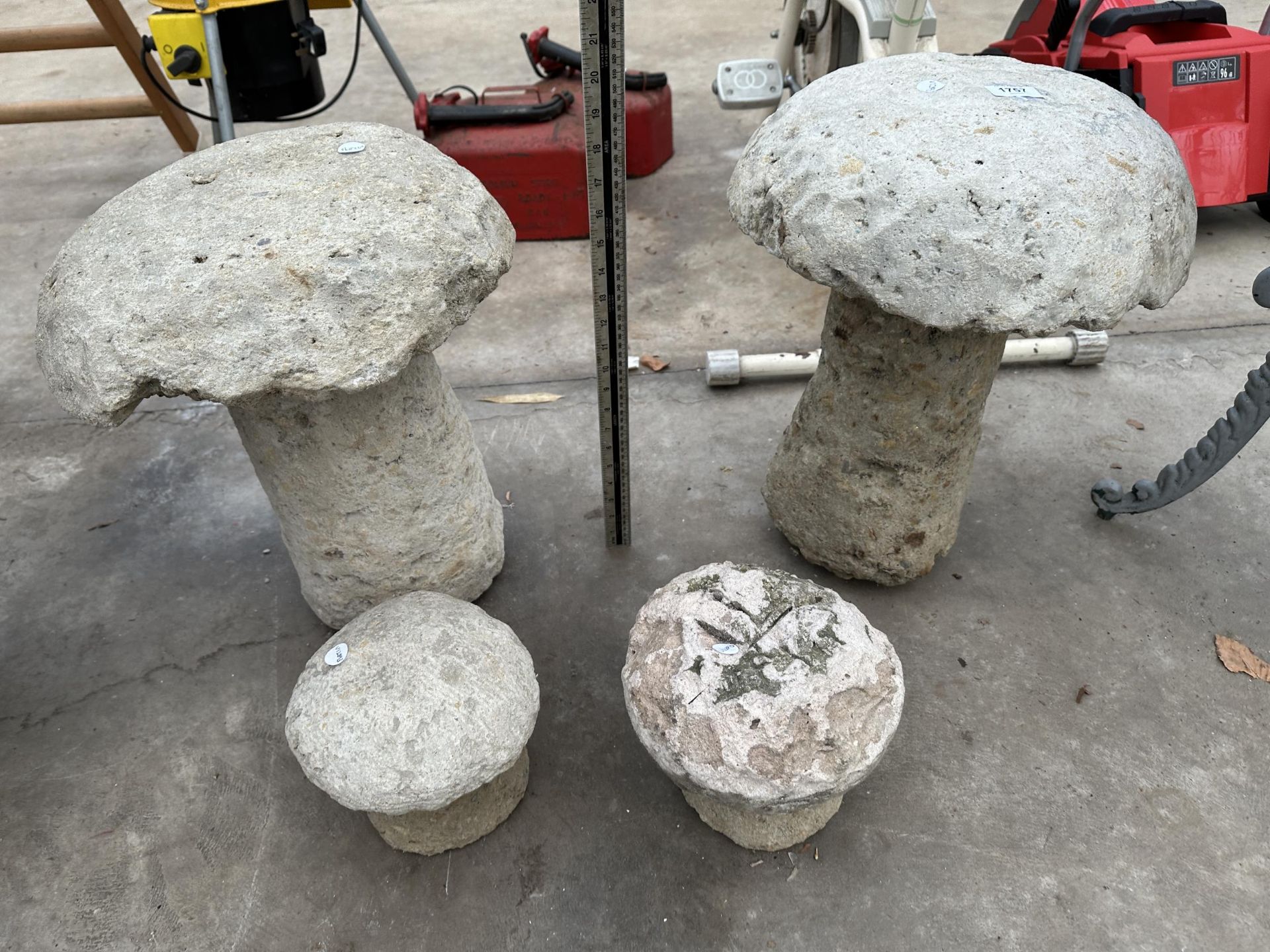 FOUR VARIOUS CONCRETE STADDLE STONES