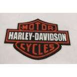 A CAST HARLEY DAVIDSON SIGN