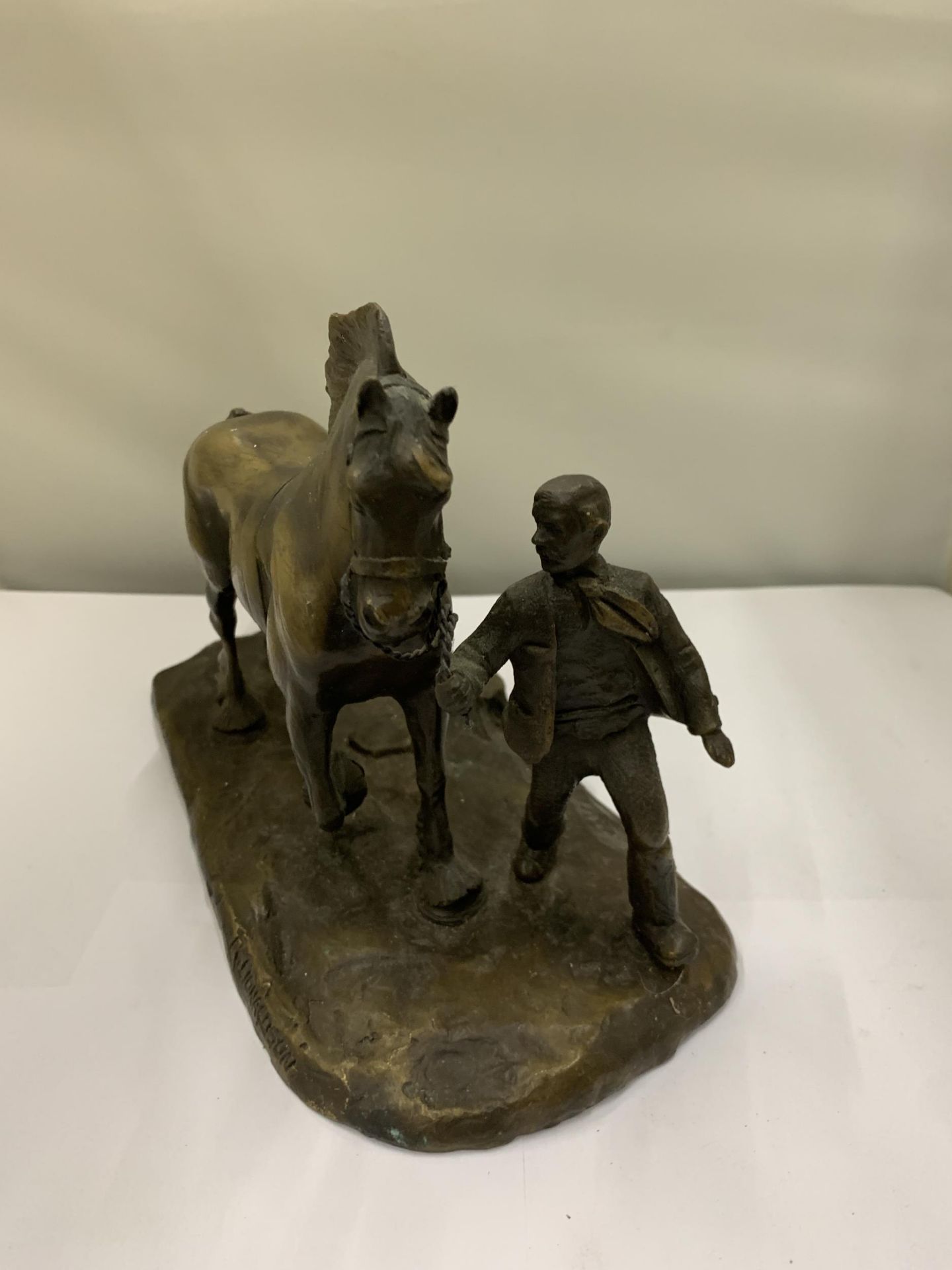 A BRONZE FIGURE OF A MAN WITH A HEAVY HORSE SIGNED R DONALDSON - Image 2 of 3