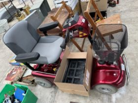 A SHOPRIDER MOBILITY SCOOTER WITH A PAIR OF RAMPS, KEY AND CHARGER IN THE OFFICE