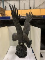 A VINTAGE HANDCARVED WOODEN EAGLE WITH REMOVEABLE WINGS HEIGHT 60CM