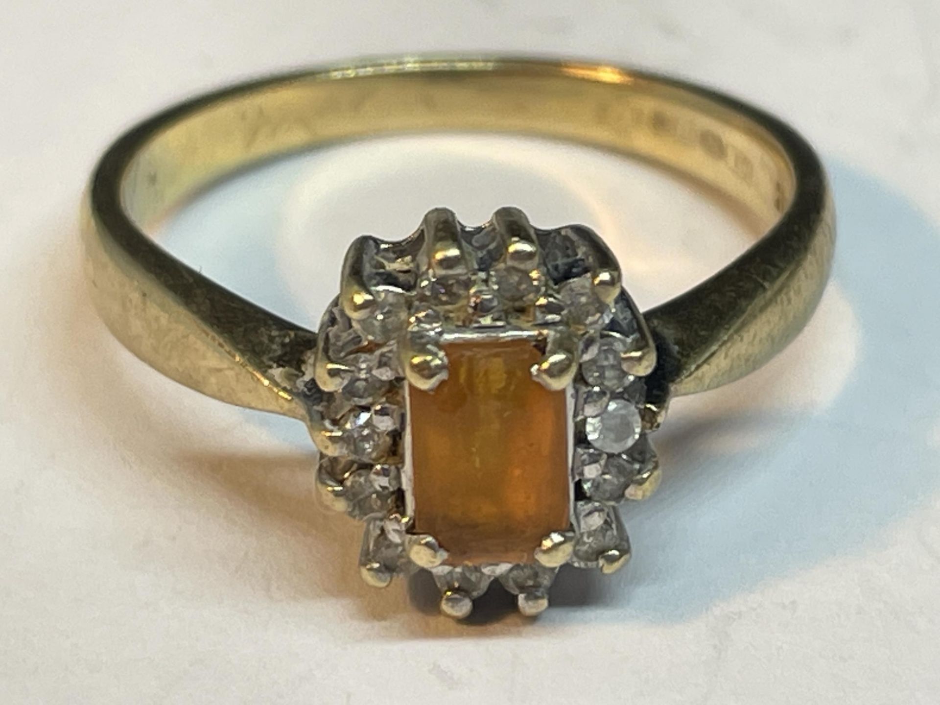 A 9 CARAT GOLD RING WITH CENTRE CITRINE SURROUNDED BY DIAMONDS SIZE O IN A PRESENTATION BOX - Image 2 of 5