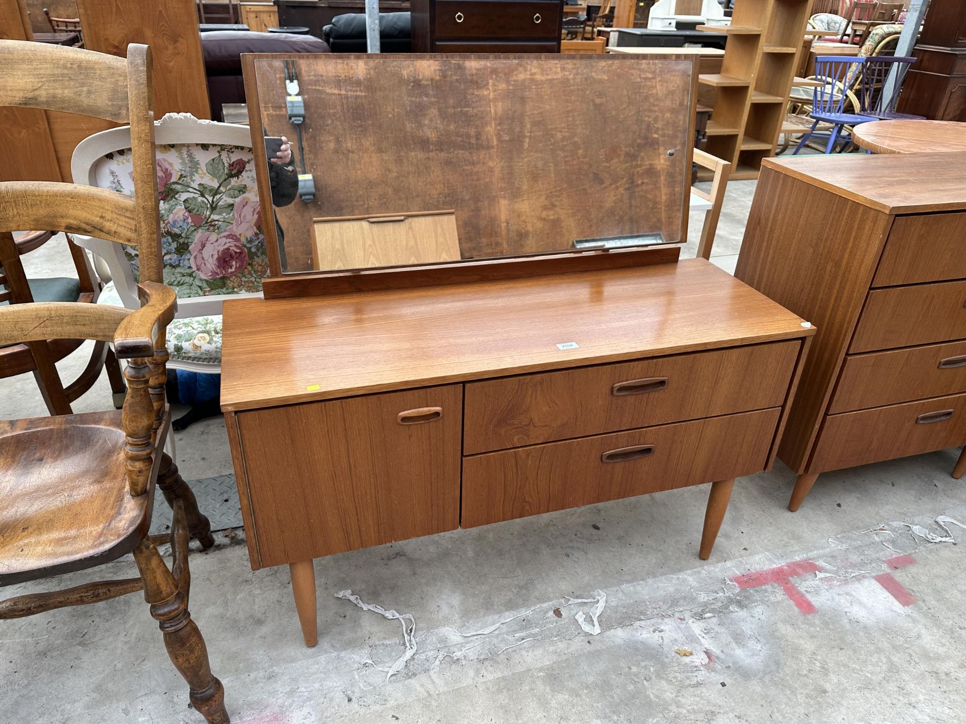 A RANELLA RETRO TEAK DRESSING CHEST ENCLOSING TWO DRAWERS AND ONE CUPBOARD 44" WIDE