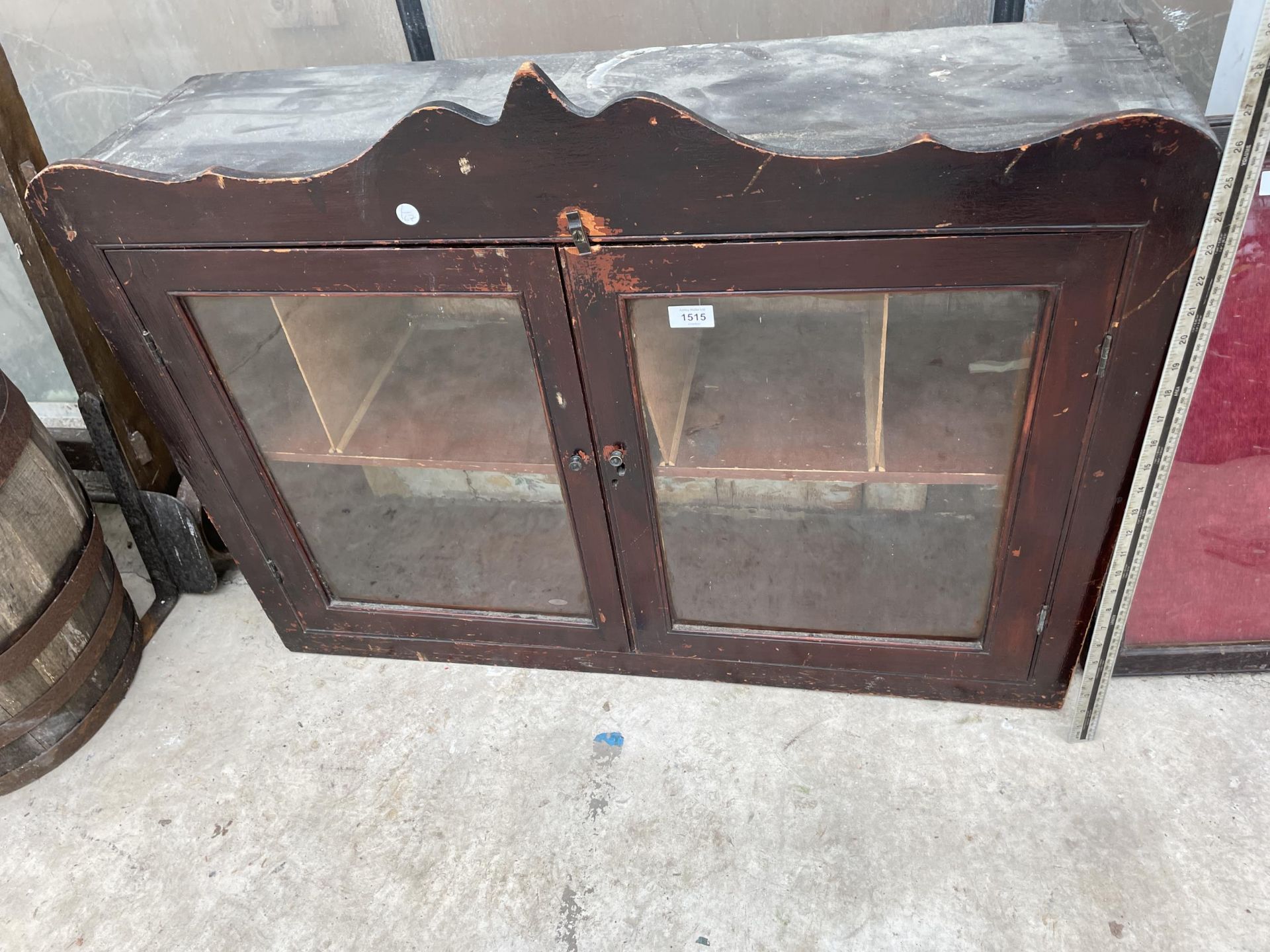 A VINTAGE MAHOGANY WALL UNIT WITH INTERNAL PIGEON HOLE SECTIONS AND GLASS DOORS