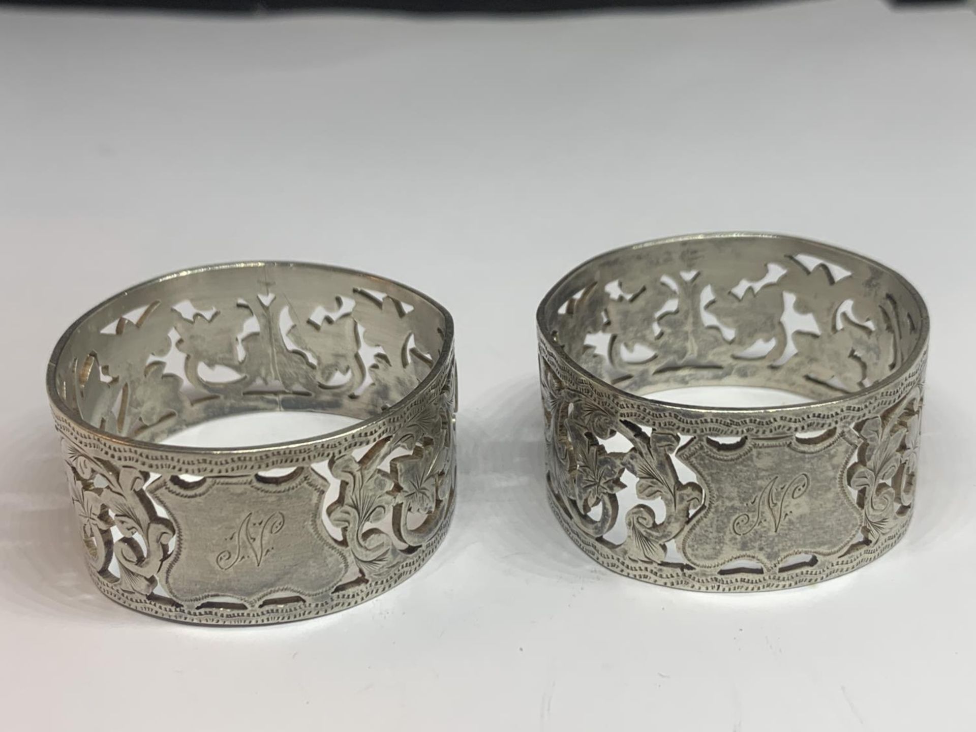 A PAIR OF HALLMARKED BIRMINGHAM SILVER NAPKIN RINGS ENGRAVED N GROSS WEIGHT 48.06 GRAMS