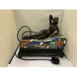 AN ART NOVEAU STYLE BRONZE LADY ON A CHAISE LOUNGE TIFFANY LAMP SEEN WORKING BUT NO WARRANTY